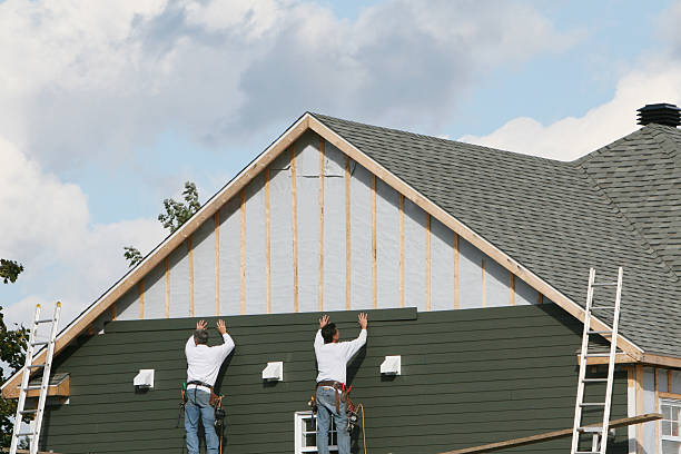 Professional Storm Damage Siding Repair technician working in Empire, OH